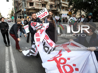 In Jerusalem, Israel, on November 29, 2024, Israeli police try to prevent demonstrators from marching as a group of Israeli demonstrators ca...