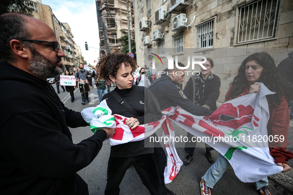 In Jerusalem, Israel, on November 29, 2024, Israeli police try to prevent demonstrators from marching as a group of Israeli demonstrators ca...