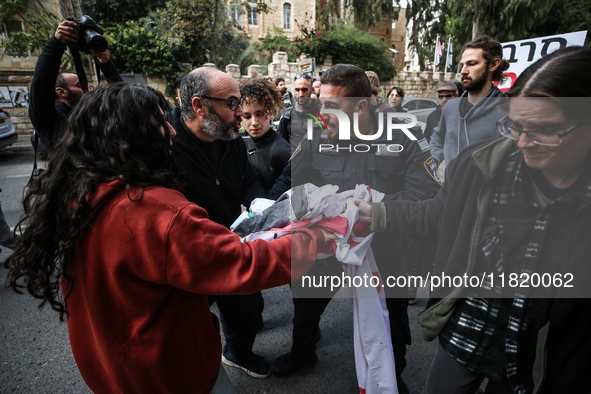 In Jerusalem, Israel, on November 29, 2024, Israeli police try to prevent demonstrators from marching as a group of Israeli demonstrators ca...