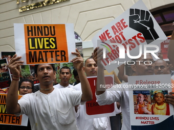 Monks of ISKCON (International Society of Krishna Consciousness) and Hindu devotees in Kolkata, India, hold a protest against the recent arr...