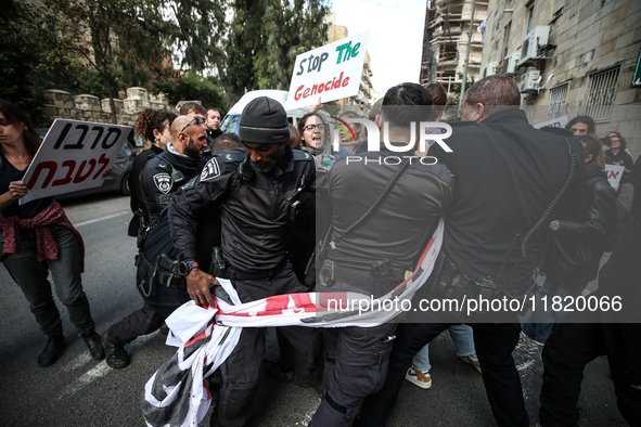 In Jerusalem, Israel, on November 29, 2024, Israeli police try to prevent demonstrators from marching as a group of Israeli demonstrators ca...