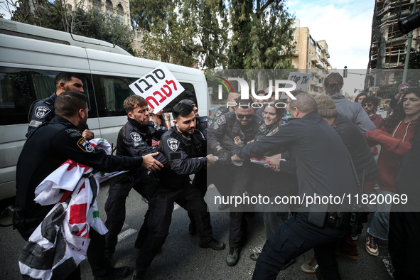 In Jerusalem, Israel, on November 29, 2024, Israeli police try to prevent demonstrators from marching as a group of Israeli demonstrators ca...