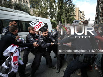 In Jerusalem, Israel, on November 29, 2024, Israeli police try to prevent demonstrators from marching as a group of Israeli demonstrators ca...