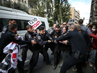 In Jerusalem, Israel, on November 29, 2024, Israeli police try to prevent demonstrators from marching as a group of Israeli demonstrators ca...