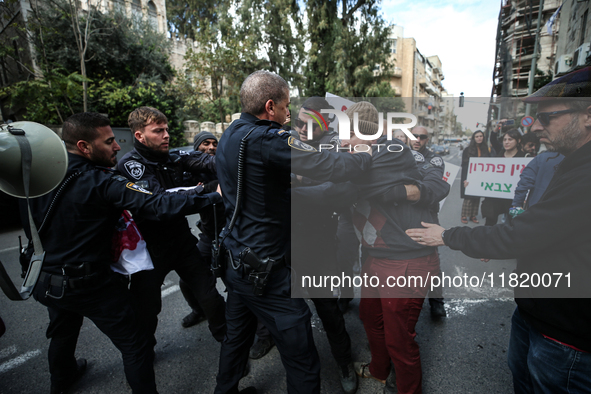 In Jerusalem, Israel, on November 29, 2024, Israeli police try to prevent demonstrators from marching as a group of Israeli demonstrators ca...