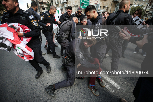 In Jerusalem, Israel, on November 29, 2024, Israeli police try to prevent demonstrators from marching as a group of Israeli demonstrators ca...