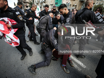 In Jerusalem, Israel, on November 29, 2024, Israeli police try to prevent demonstrators from marching as a group of Israeli demonstrators ca...