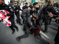 In Jerusalem, Israel, on November 29, 2024, Israeli police try to prevent demonstrators from marching as a group of Israeli demonstrators ca...