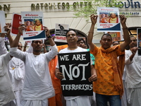 Monks of ISKCON (International Society of Krishna Consciousness) and Hindu devotees in Kolkata, India, hold a protest against the recent arr...