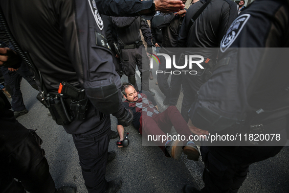 In Jerusalem, Israel, on November 29, 2024, Israeli police try to prevent demonstrators from marching as a group of Israeli demonstrators ca...