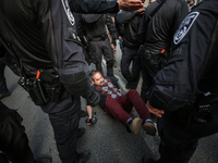 In Jerusalem, Israel, on November 29, 2024, Israeli police try to prevent demonstrators from marching as a group of Israeli demonstrators ca...