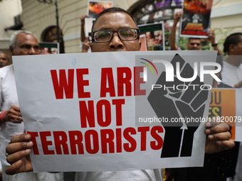 Monks of ISKCON (International Society of Krishna Consciousness) and Hindu devotees in Kolkata, India, hold a protest against the recent arr...