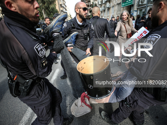 In Jerusalem, Israel, on November 29, 2024, Israeli police try to prevent demonstrators from marching as a group of Israeli demonstrators ca...