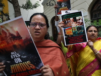 Monks of ISKCON (International Society of Krishna Consciousness) and Hindu devotees in Kolkata, India, hold a protest against the recent arr...