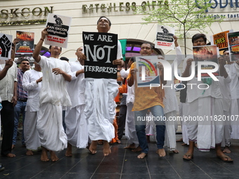 Monks of ISKCON (International Society of Krishna Consciousness) and Hindu devotees in Kolkata, India, hold a protest against the recent arr...