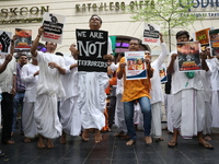 Monks of ISKCON (International Society of Krishna Consciousness) and Hindu devotees in Kolkata, India, hold a protest against the recent arr...