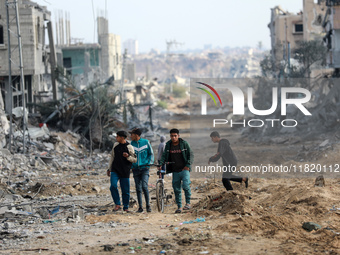 Palestinians inspect the destruction as displaced residents return to Nuseirat in the central Gaza Strip after Israeli shelling of the camp...