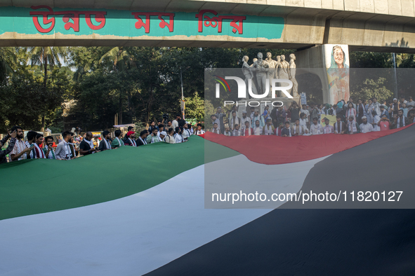 Students of Dhaka University organize a ''March for Palestine'' in Dhaka, Bangladesh, on November 29, 2024, to mark the International Day of...