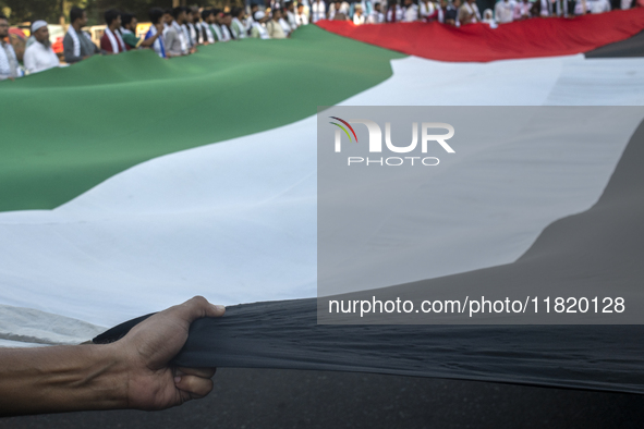 Students of Dhaka University organize a ''March for Palestine'' in Dhaka, Bangladesh, on November 29, 2024, to mark the International Day of...