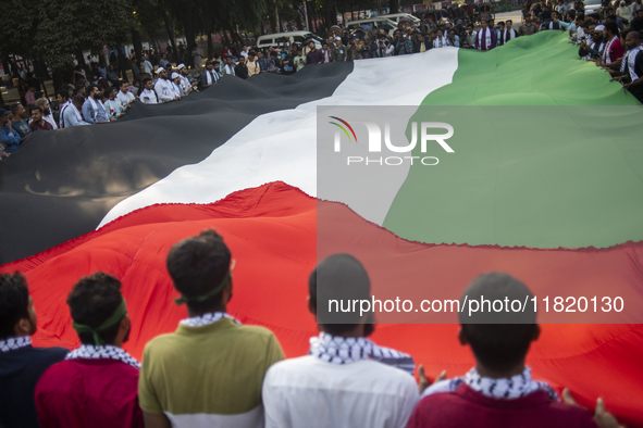 Students of Dhaka University organize a ''March for Palestine'' in Dhaka, Bangladesh, on November 29, 2024, to mark the International Day of...