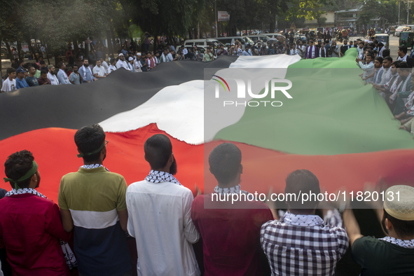 Students of Dhaka University organize a ''March for Palestine'' in Dhaka, Bangladesh, on November 29, 2024, to mark the International Day of...