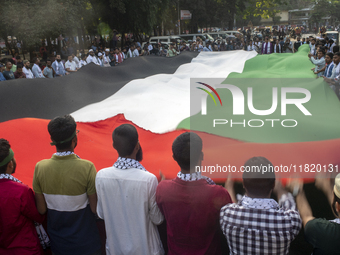 Students of Dhaka University organize a ''March for Palestine'' in Dhaka, Bangladesh, on November 29, 2024, to mark the International Day of...