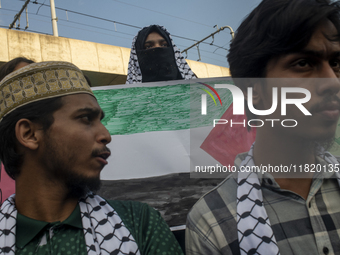 Students of Dhaka University organize a ''March for Palestine'' in Dhaka, Bangladesh, on November 29, 2024, to mark the International Day of...