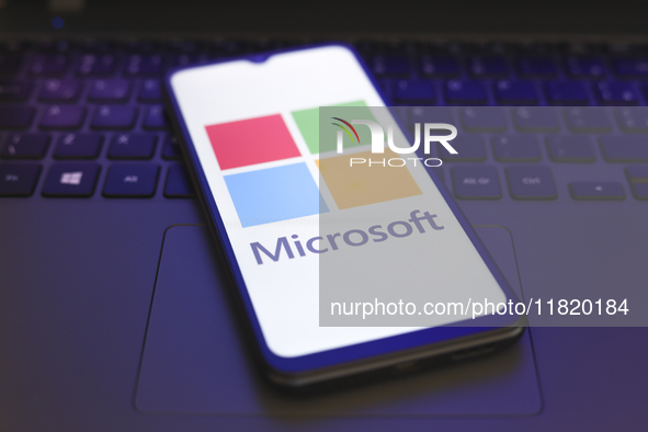 The Microsoft Corporation logo appears on the screen of a smartphone in Reno, United States, on November 29, 2024. 