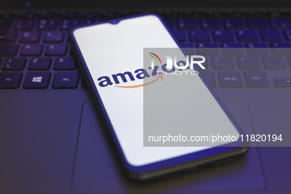 The Amazon logo appears on the screen of a smartphone in Reno, United States, on November 29, 2024. 