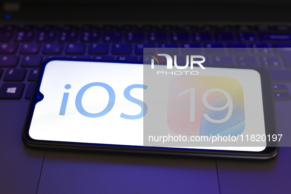 The Apple iOS 19 logo appears on the screen of a smartphone in Reno, United States, on November 29, 2024. 