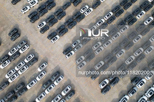 New energy vehicles park in Changansuzuki's parking lot in Chongqing, China, on November 28, 2024. 