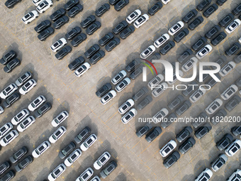 New energy vehicles park in Changansuzuki's parking lot in Chongqing, China, on November 28, 2024. (