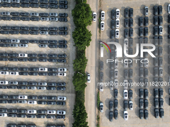 New energy vehicles park in Changansuzuki's parking lot in Chongqing, China, on November 28, 2024. (