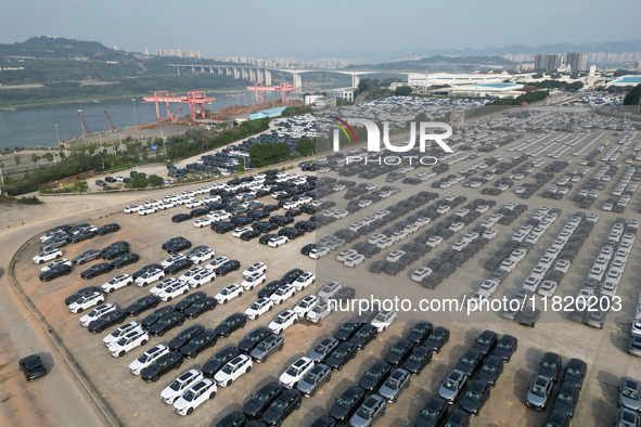 New energy vehicles park in Changansuzuki's parking lot in Chongqing, China, on November 28, 2024. 