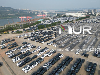 New energy vehicles park in Changansuzuki's parking lot in Chongqing, China, on November 28, 2024. (