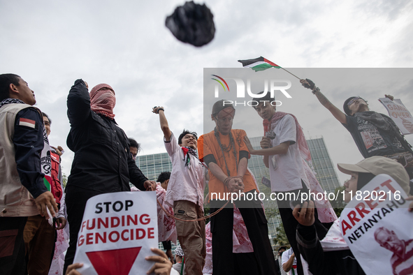 The theatrical performance takes place during the solidarity action for the Palestinian people in front of the United States Embassy in Jaka...