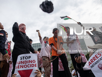 The theatrical performance takes place during the solidarity action for the Palestinian people in front of the United States Embassy in Jaka...