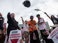 The theatrical performance takes place during the solidarity action for the Palestinian people in front of the United States Embassy in Jaka...