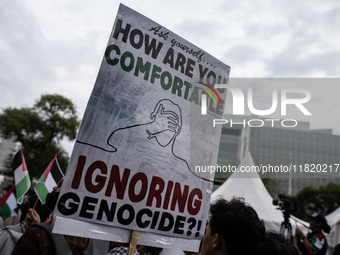 Indonesian people shout slogans and hold placards during a pro-Palestinian demonstration in front of the US Embassy in Jakarta, Indonesia, o...