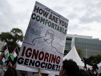 Indonesian people shout slogans and hold placards during a pro-Palestinian demonstration in front of the US Embassy in Jakarta, Indonesia, o...