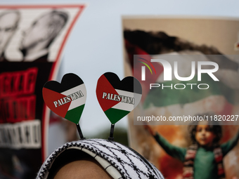 Indonesian people shout slogans and hold placards during a pro-Palestinian demonstration in front of the US Embassy in Jakarta, Indonesia, o...