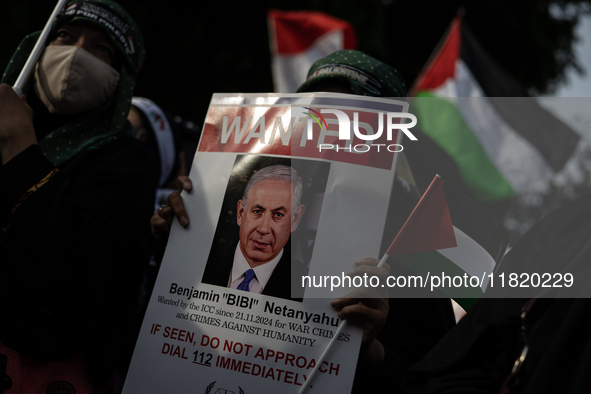 An Indonesian woman attends a rally during a pro-Palestinian demonstration in front of the US Embassy in Jakarta, Indonesia, on November 29,...