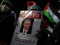 An Indonesian woman attends a rally during a pro-Palestinian demonstration in front of the US Embassy in Jakarta, Indonesia, on November 29,...