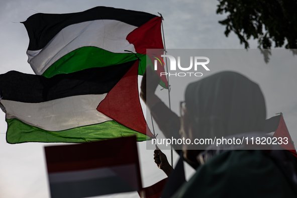 Indonesian people shout slogans and hold placards during a pro-Palestinian demonstration in front of the US Embassy in Jakarta, Indonesia, o...