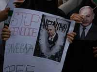 Indonesian people shout slogans and hold placards during a pro-Palestinian demonstration in front of the US Embassy in Jakarta, Indonesia, o...