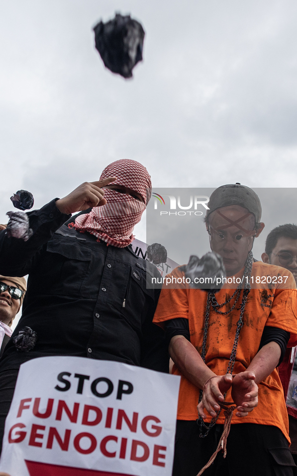 The theatrical performance takes place during the solidarity action for the Palestinian people in front of the United States Embassy in Jaka...