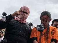 The theatrical performance takes place during the solidarity action for the Palestinian people in front of the United States Embassy in Jaka...