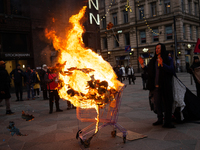 Activists from Elokapina, or Extinction Rebellion Finland, protest against Black Friday in Helsinki, Finland, on November 29, 2024. The acti...