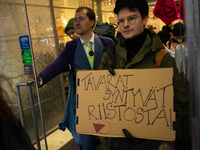 Activists from Elokapina, or Extinction Rebellion Finland, protest against Black Friday in Helsinki, Finland, on November 29, 2024. The acti...