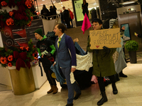 Activists from Elokapina, or Extinction Rebellion Finland, protest against Black Friday in Helsinki, Finland, on November 29, 2024. The acti...